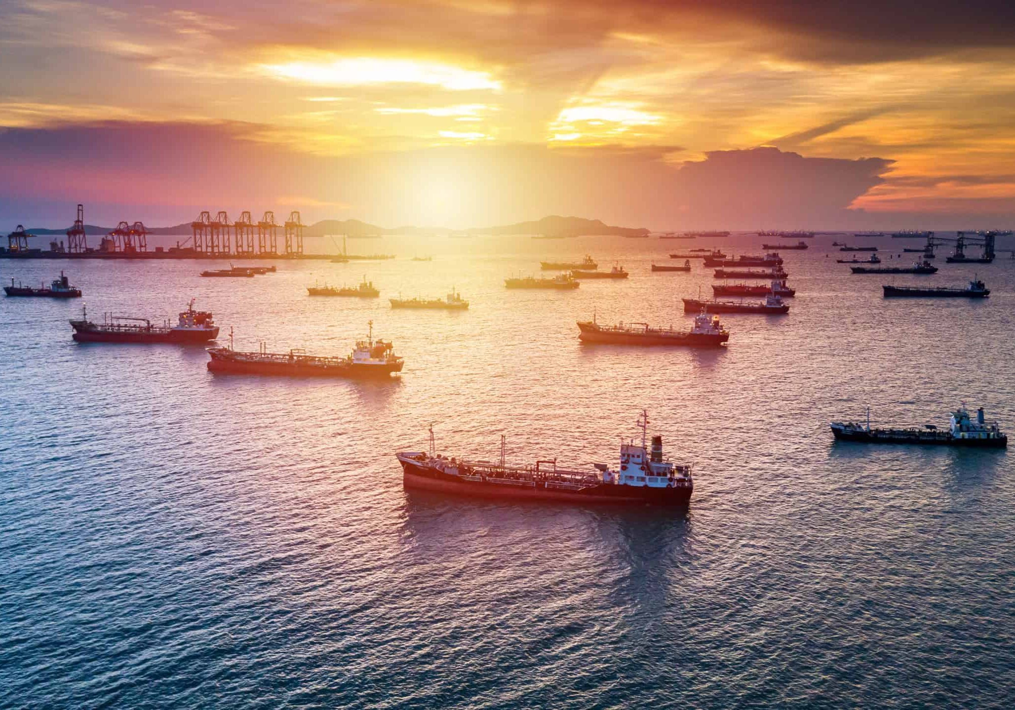 Aerial view tanker cargo vessel oil and gas petrochemical in oil terminal, Global business commercial trade freight fuel chemical and natural gas logistic industry refinery worldwide.